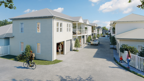Artists impression of a residential community. White two-storey weatherboard homes line the street.
